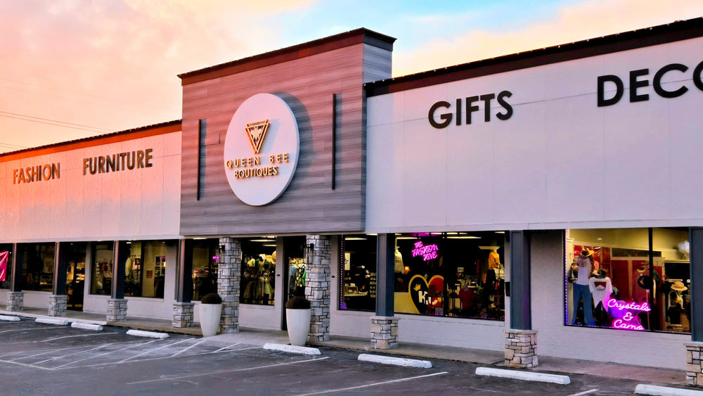 Storefront with 'Furniture and More' sign and parking lot in front